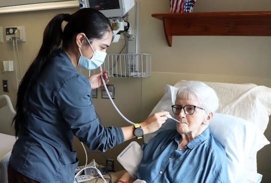 Nurse with geriatric patient