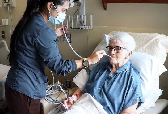 Nurse with geriatric patient